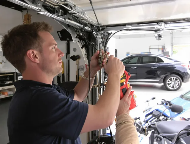 Murrieta Garage Door Repair safety certified technician performing cable replacement in Murrieta