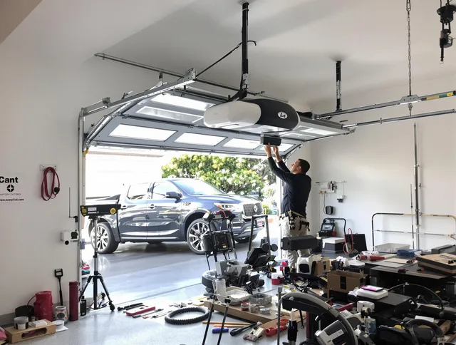 Murrieta Garage Door Repair specialist installing smart garage door opener system in Murrieta home